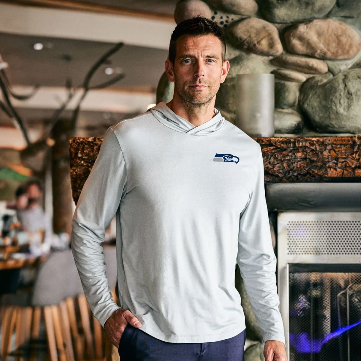Man wearing a Gray Cutter Buck Seattle Seahawks Coastline Eco Mens Hoodie