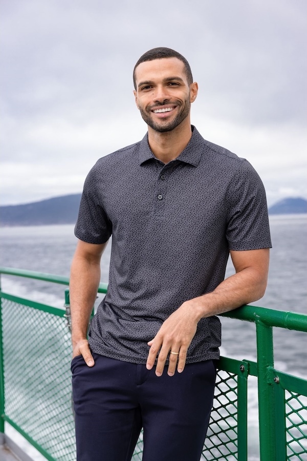 Man wearing a gray Cutter & Buck Pike luxury print polo