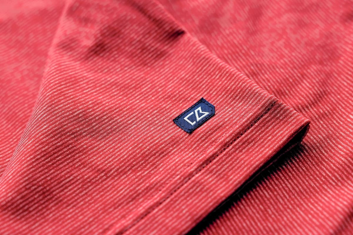 Close up of red Adapt Stripe men's hood pullover